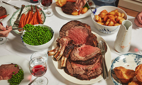 Bone-⁠In Westholme Ribeye Roast with Roasted Carrots, Crispy Potatoes, Peas and Yorkshire Puddings